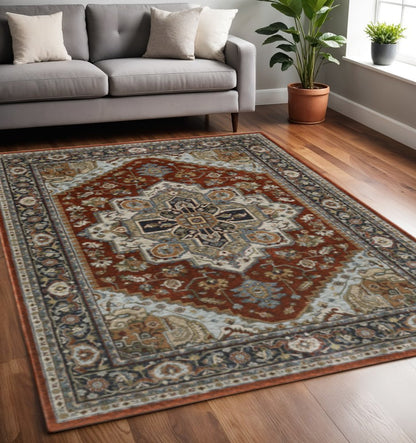 5' X 8' Blue Beige Grey Gold Green And Rust Red Oriental Power Loom Stain Resistant Area Rug With Fringe
