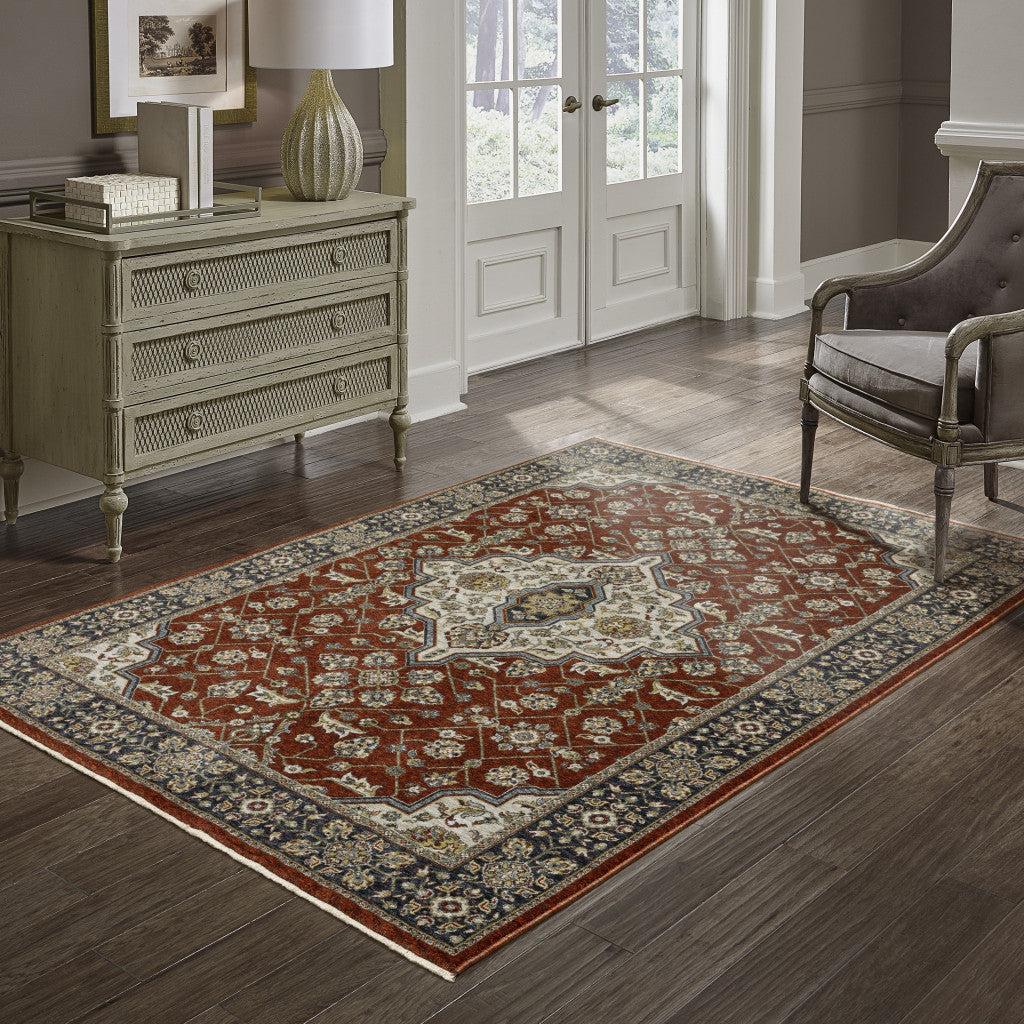 2' X 3' Red Ivory Blue Navy Gold And Grey Oriental Power Loom Stain Resistant Area Rug With Fringe