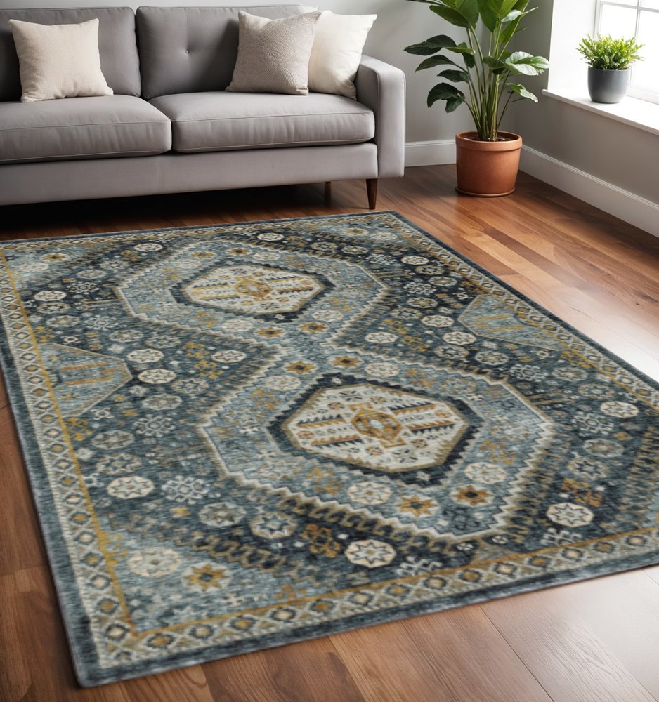 5' X 8' Blue Gold Ivory And Navy Oriental Power Loom Stain Resistant Area Rug With Fringe
