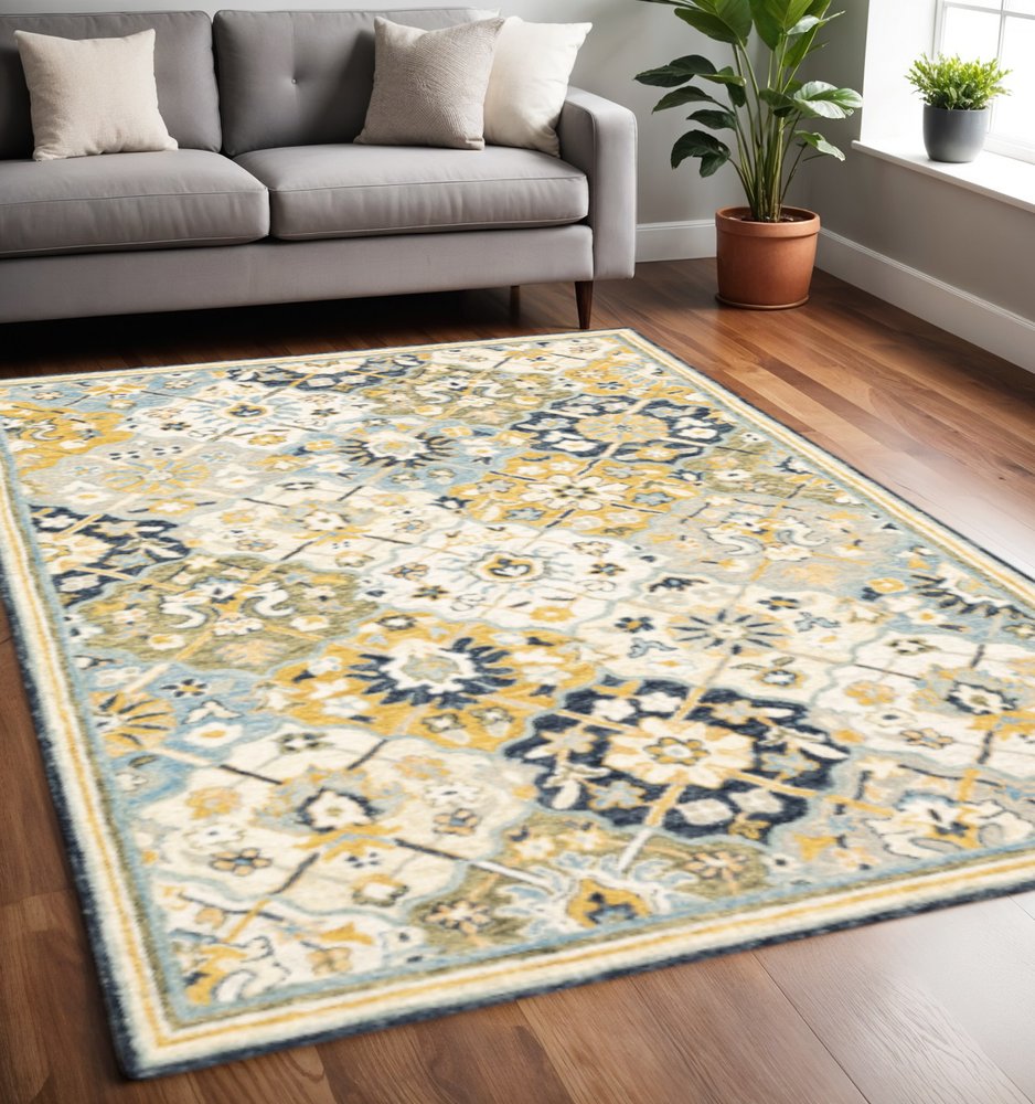 5' X 8' Blue Green Gold Navy And Ivory Geometric Tufted Handmade Stain Resistant Area Rug
