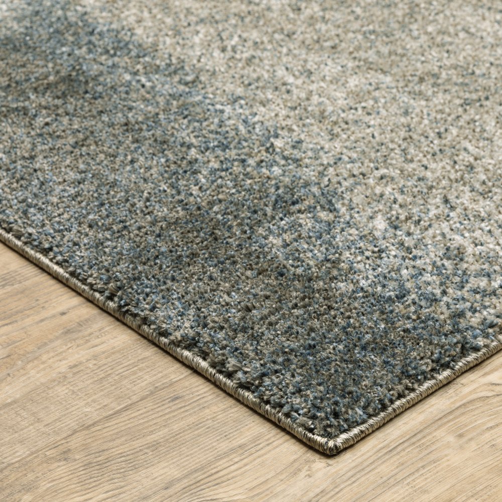 5' X 8' Beige And Blue Abstract Distressed Area Rug