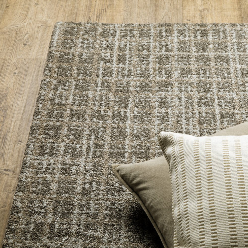 5' X 8' Brown And Beige Geometric Distressed Area Rug