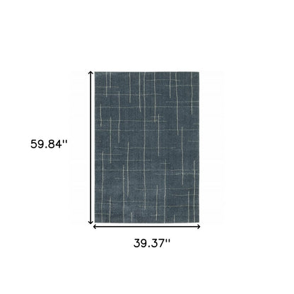 3' X 5' Blue And Beige Geometric Distressed Area Rug