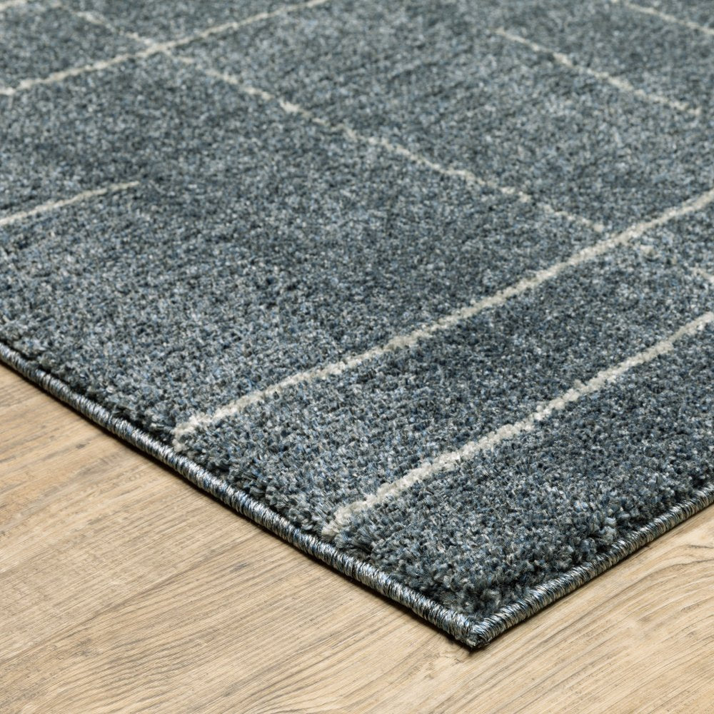 3' X 5' Blue And Beige Geometric Distressed Area Rug