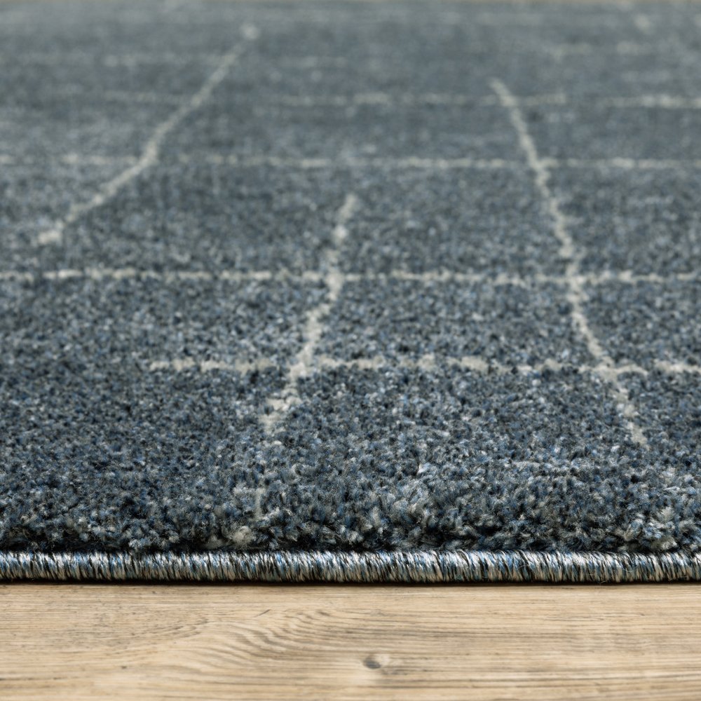 3' X 5' Blue And Beige Geometric Distressed Area Rug