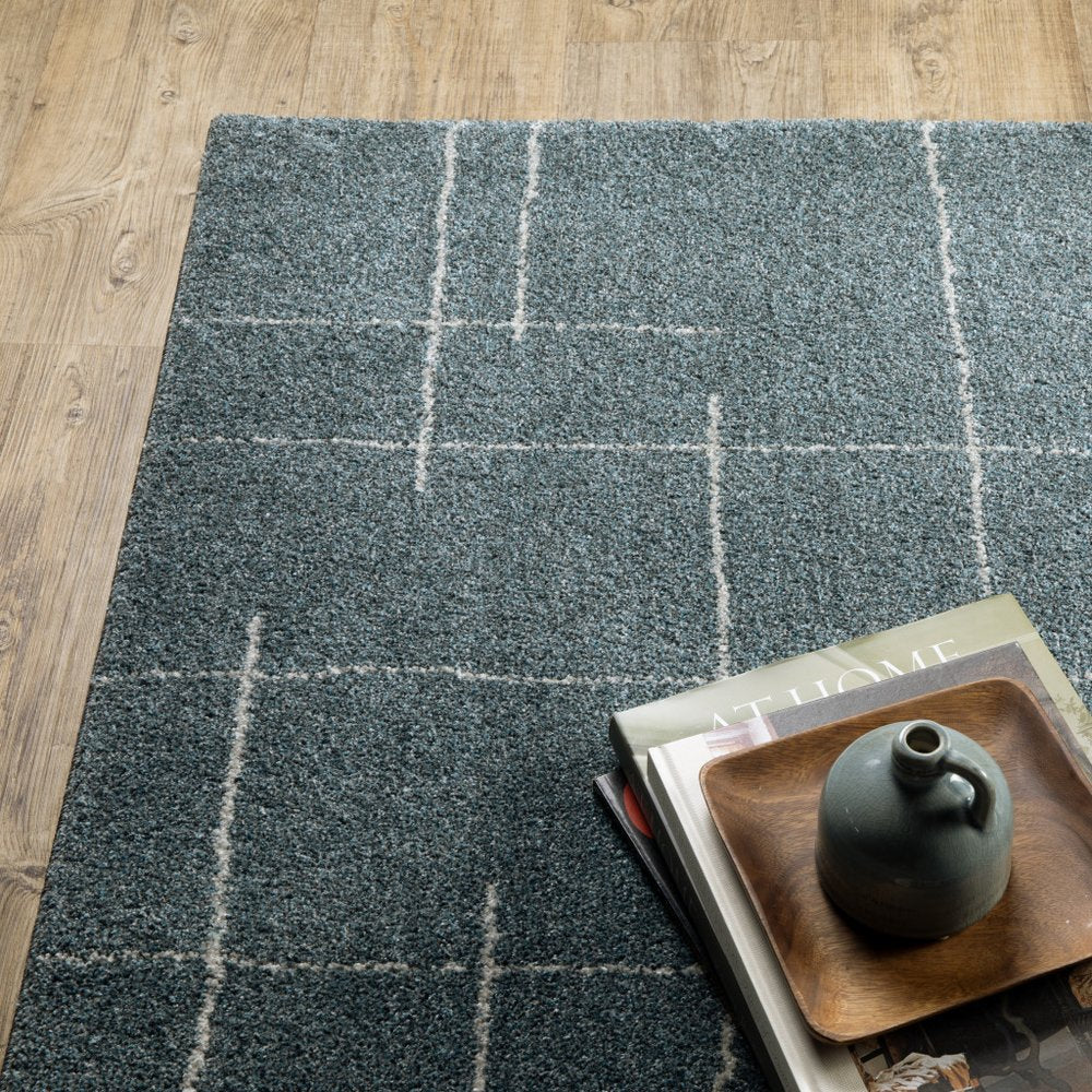 3' X 5' Blue And Beige Geometric Distressed Area Rug