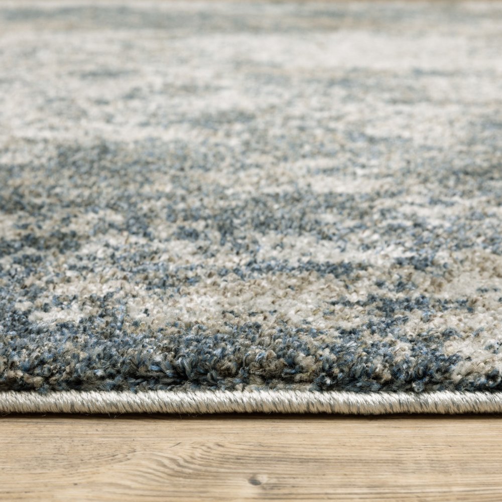 10' X 13' Blue And Beige Abstract Distressed Area Rug