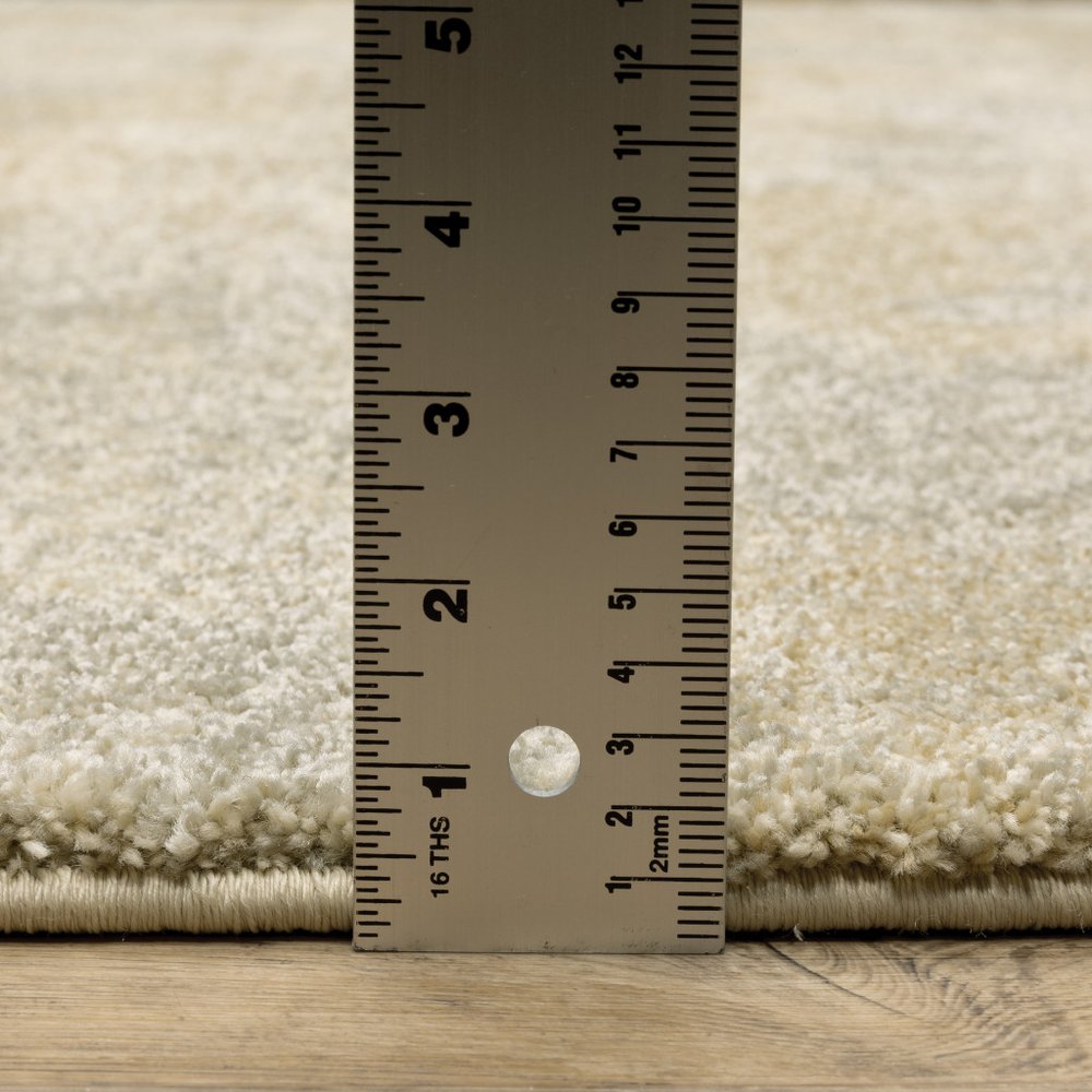 2' X 8' Grey Ivory Beige And Taupe Abstract Power Loom Stain Resistant Runner Rug