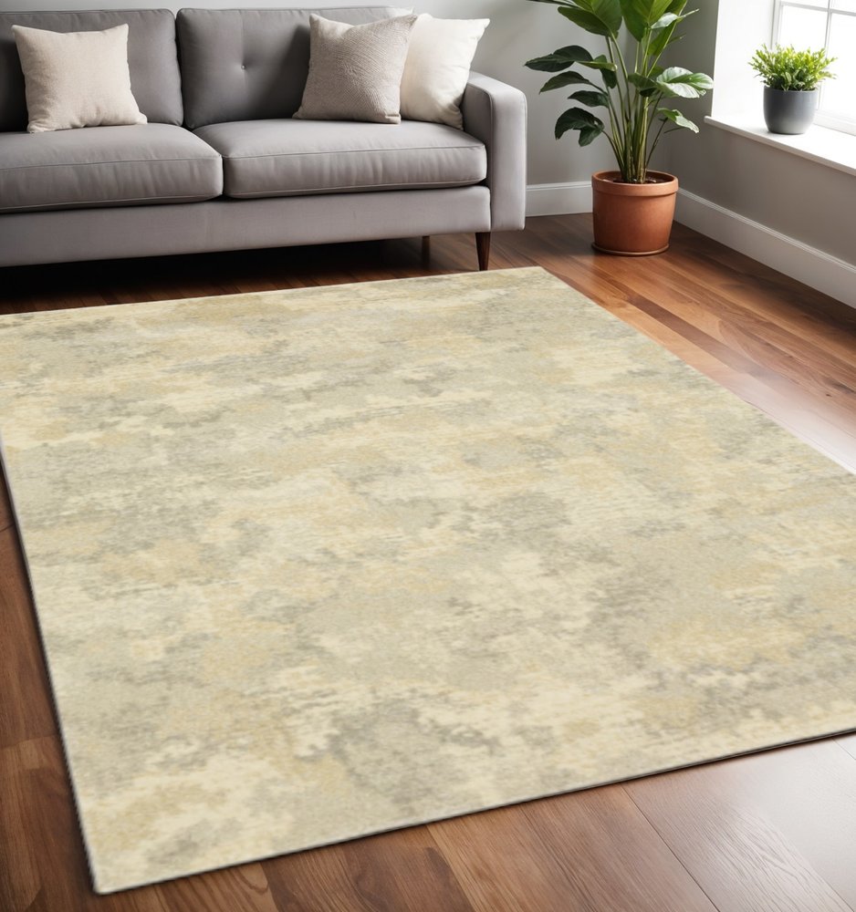 5' X 8' Grey Ivory Beige And Taupe Abstract Power Loom Stain Resistant Area Rug