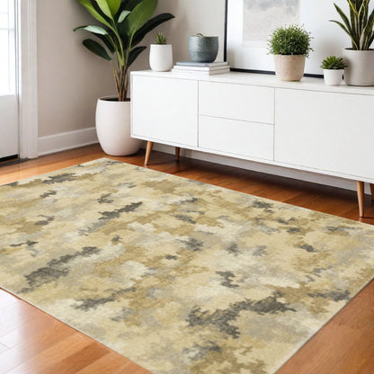 3' X 5' Beige Grey And Gold Abstract Power Loom Stain Resistant Area Rug