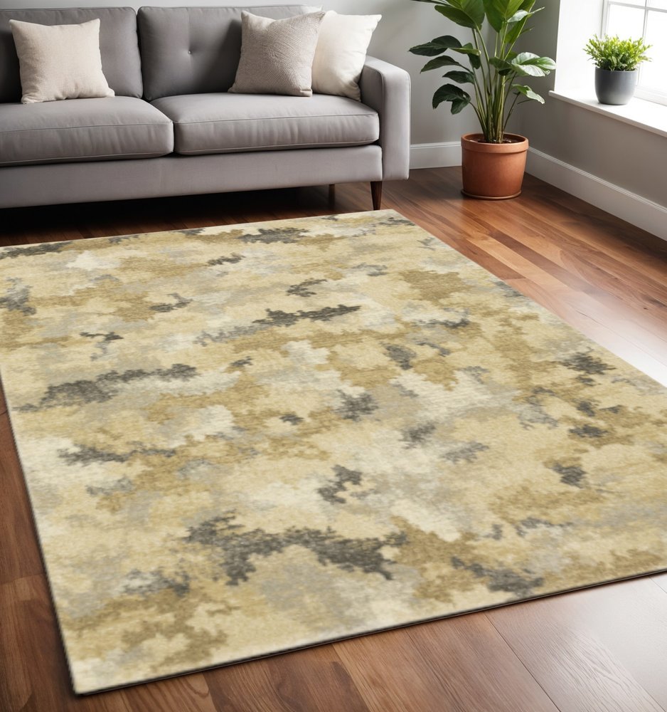 5' X 8' Beige Grey And Gold Abstract Power Loom Stain Resistant Area Rug