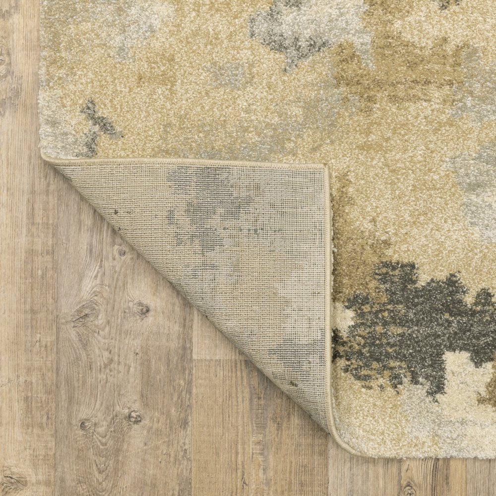 5' X 8' Beige Grey And Gold Abstract Power Loom Stain Resistant Area Rug