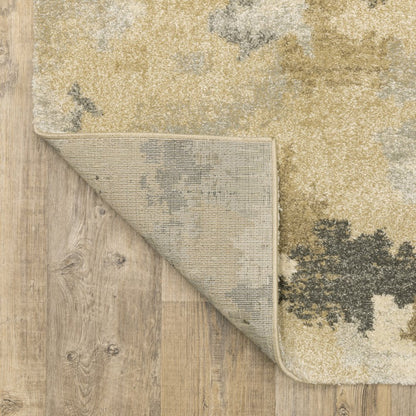 5' X 8' Beige Grey And Gold Abstract Power Loom Stain Resistant Area Rug