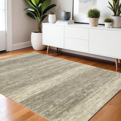 3' X 5' Grey Beige And Tan Abstract Power Loom Stain Resistant Area Rug