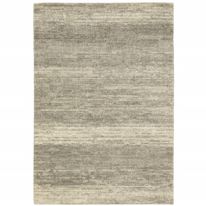 5' X 8' Grey Beige And Tan Abstract Power Loom Stain Resistant Area Rug