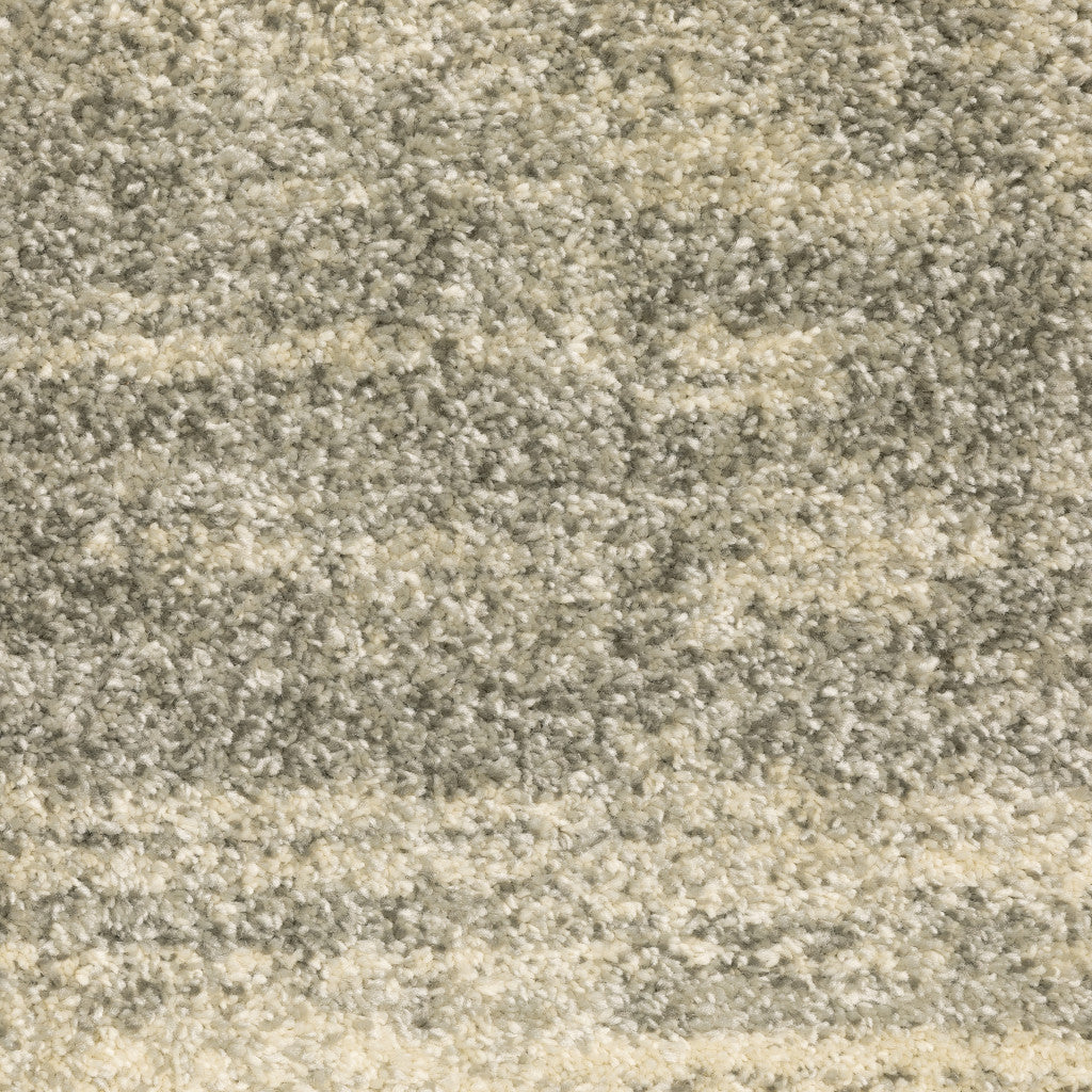 5' X 8' Grey Beige And Tan Abstract Power Loom Stain Resistant Area Rug