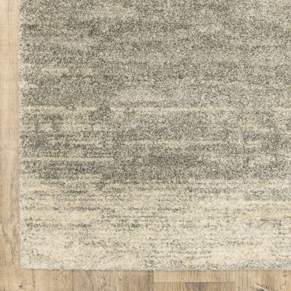 5' X 8' Grey Beige And Tan Abstract Power Loom Stain Resistant Area Rug