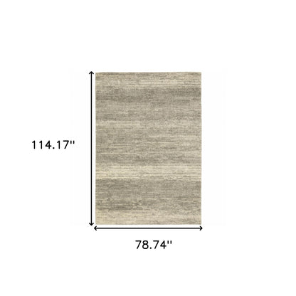 6' X 9' Grey Beige And Tan Abstract Power Loom Stain Resistant Area Rug