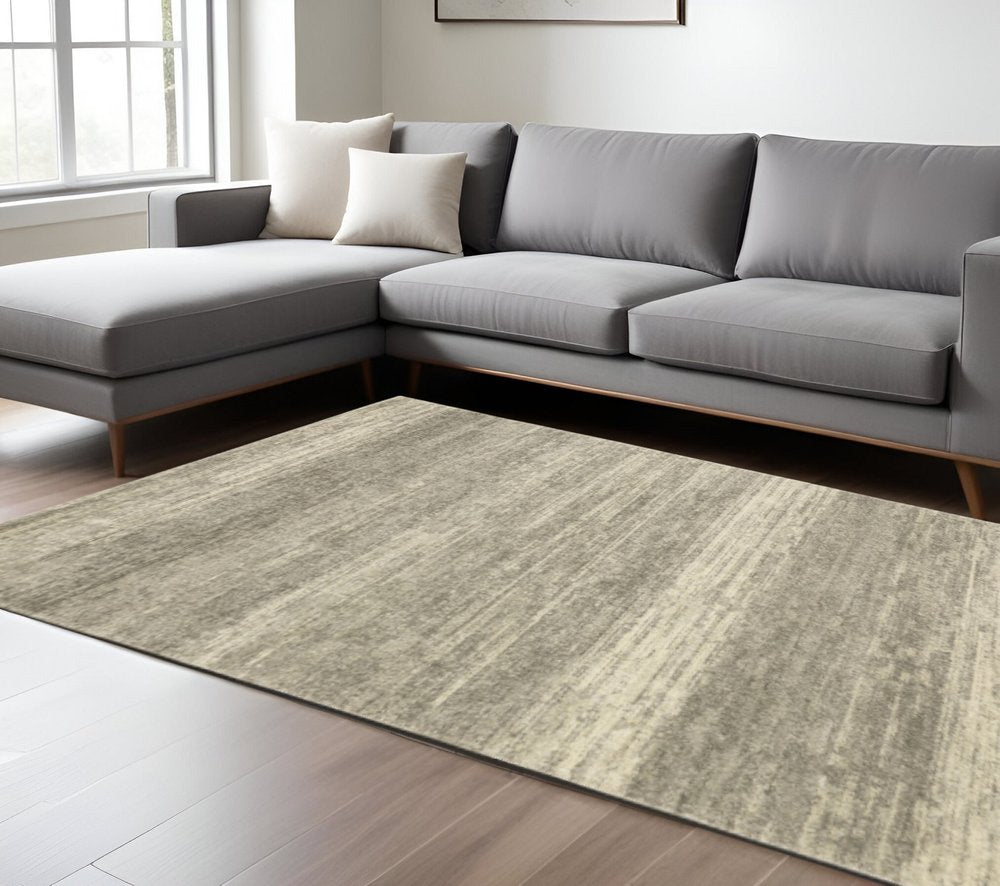 6' X 9' Grey Beige And Tan Abstract Power Loom Stain Resistant Area Rug