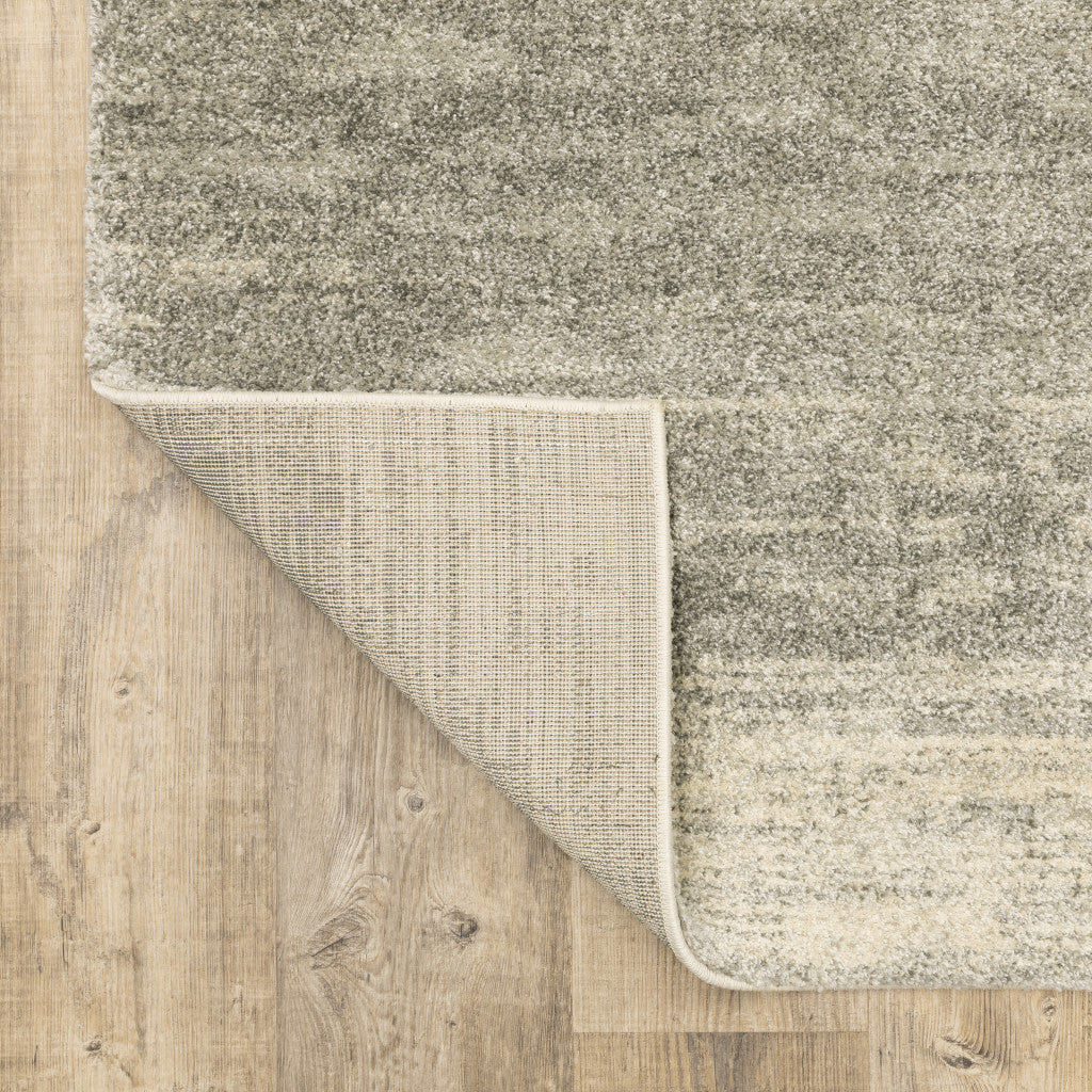 6' X 9' Grey Beige And Tan Abstract Power Loom Stain Resistant Area Rug