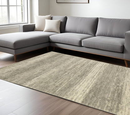 8' X 11' Grey Beige And Tan Abstract Power Loom Stain Resistant Area Rug