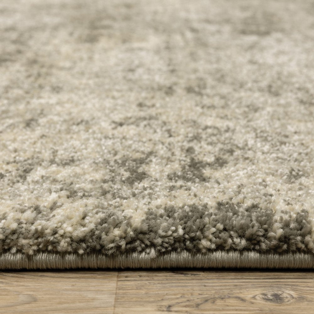 6' X 9' Grey Ivory Beige And Taupe Oriental Power Loom Stain Resistant Area Rug