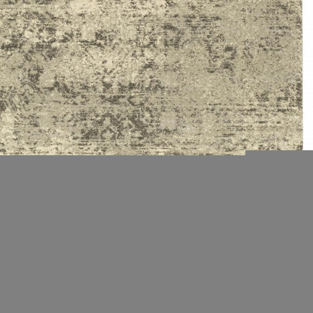 6' X 9' Grey Ivory Beige And Taupe Oriental Power Loom Stain Resistant Area Rug