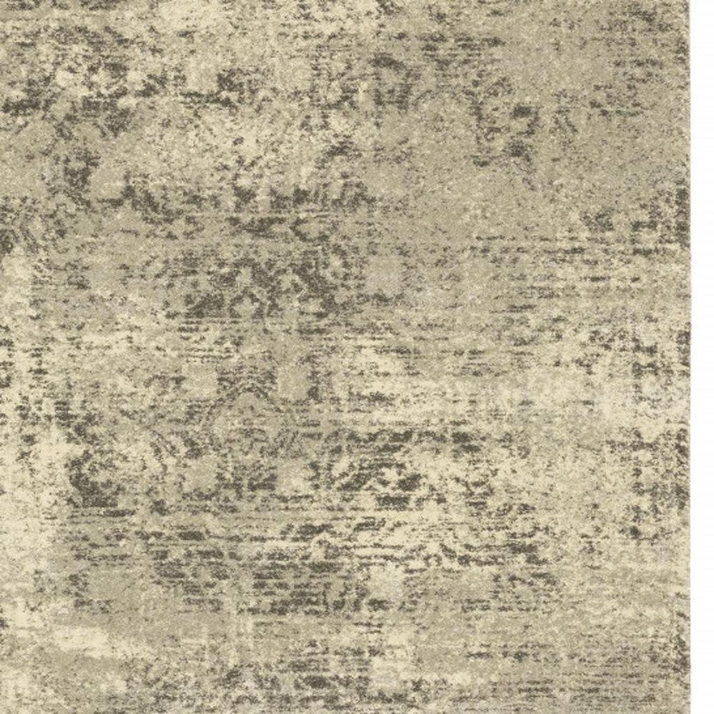6' X 9' Grey Ivory Beige And Taupe Oriental Power Loom Stain Resistant Area Rug