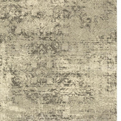 6' X 9' Grey Ivory Beige And Taupe Oriental Power Loom Stain Resistant Area Rug
