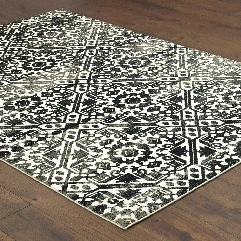 7' X 10' Navy Blue And Ivory Geometric Distressed Area Rug