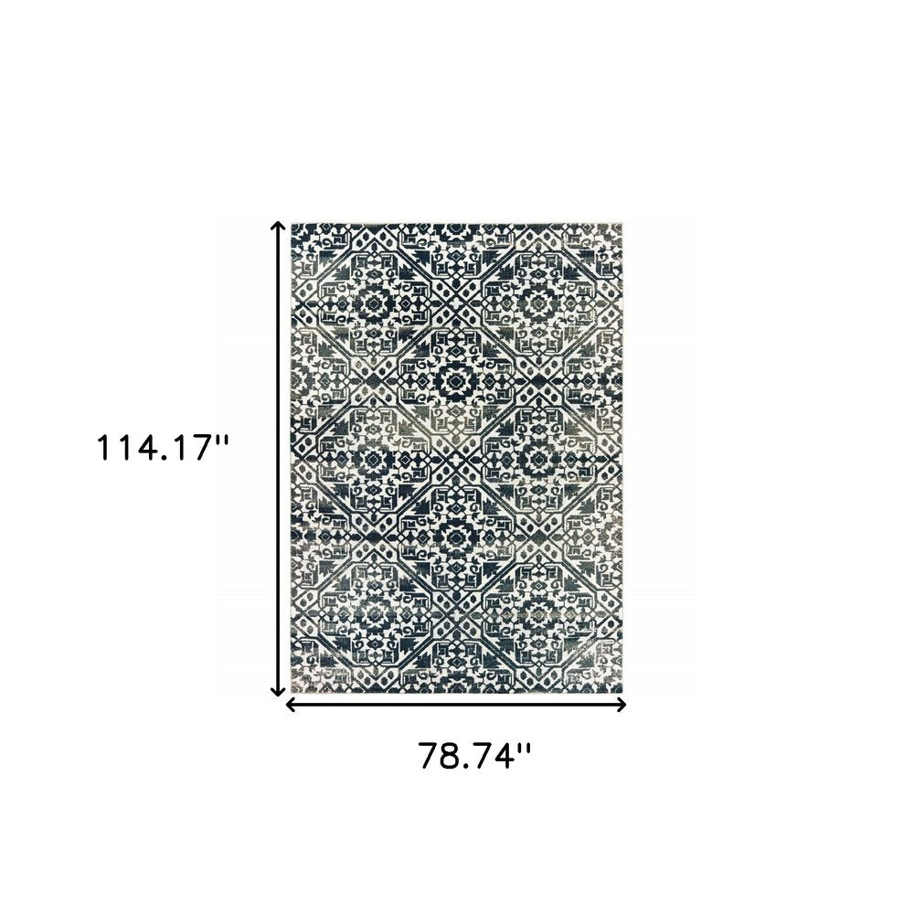 7' X 10' Navy Blue And Ivory Geometric Distressed Area Rug