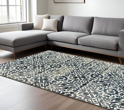 7' X 10' Navy Blue And Ivory Geometric Distressed Area Rug
