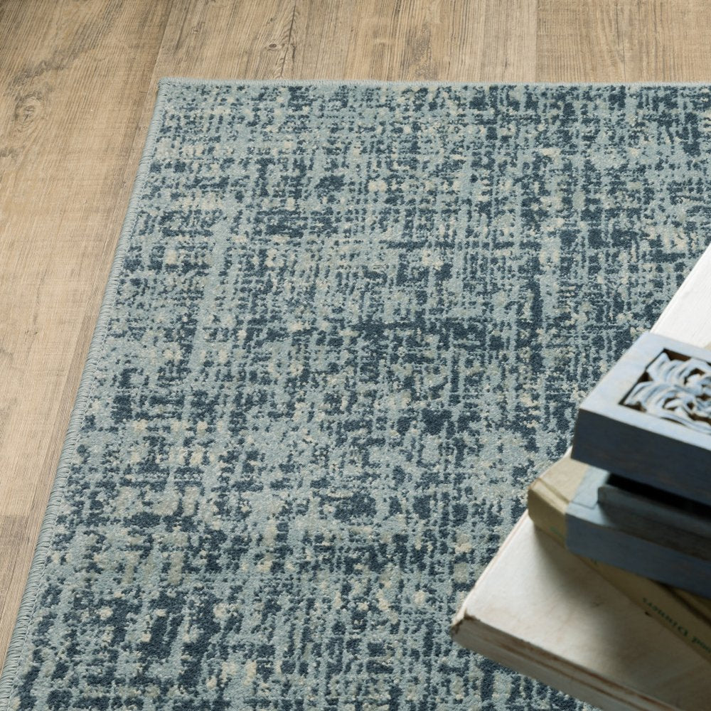 7' X 9' Blue And Beige Abstract Area Rug