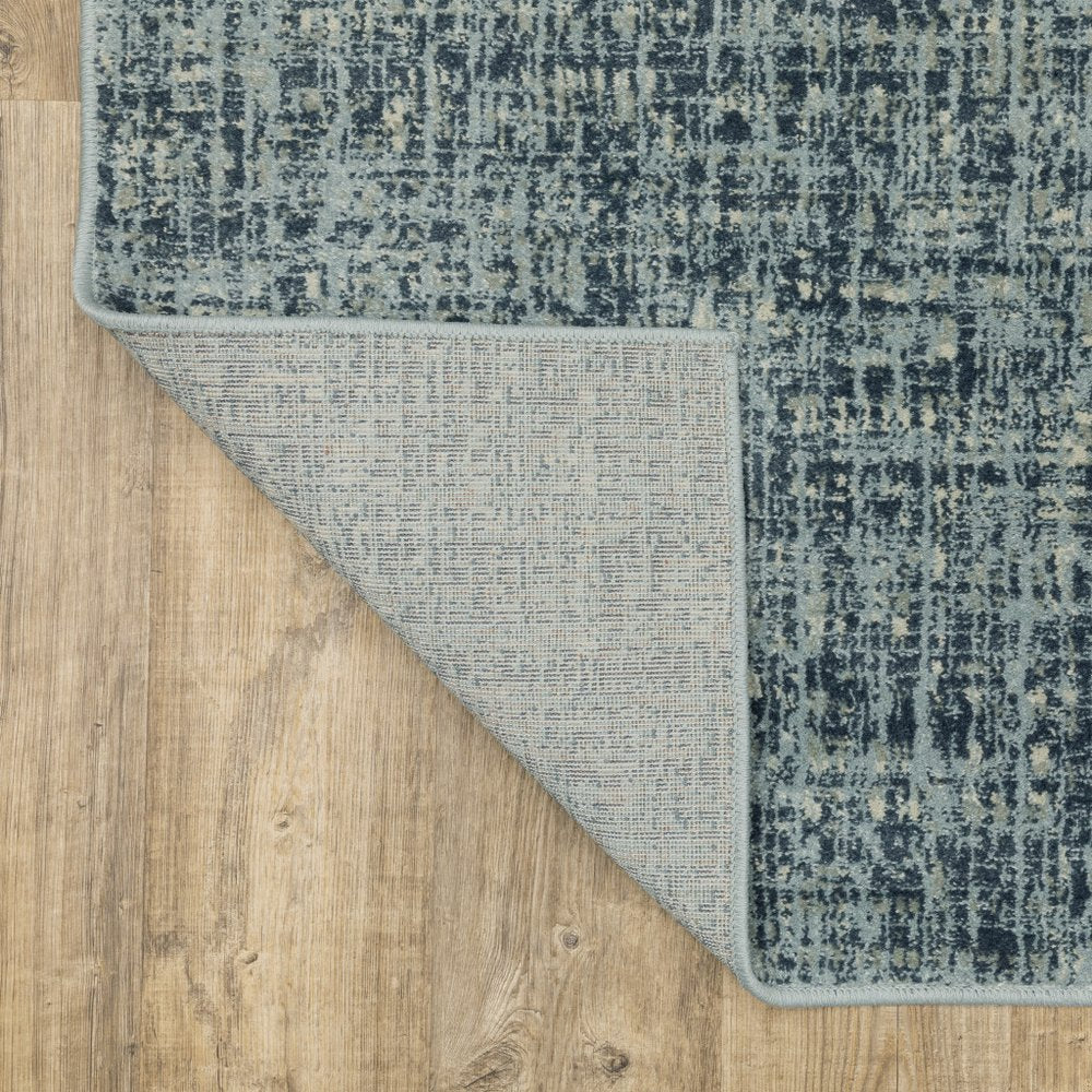 7' X 9' Blue And Beige Abstract Area Rug