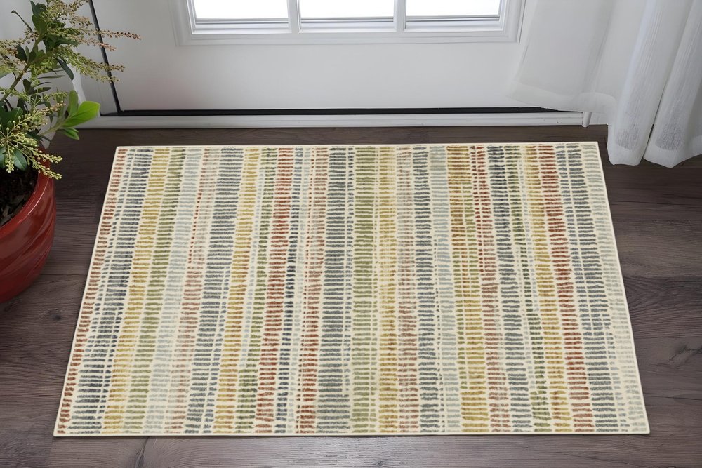 3' X 5' Ivory Blue Green Red And Gold Geometric Power Loom Stain Resistant Area Rug