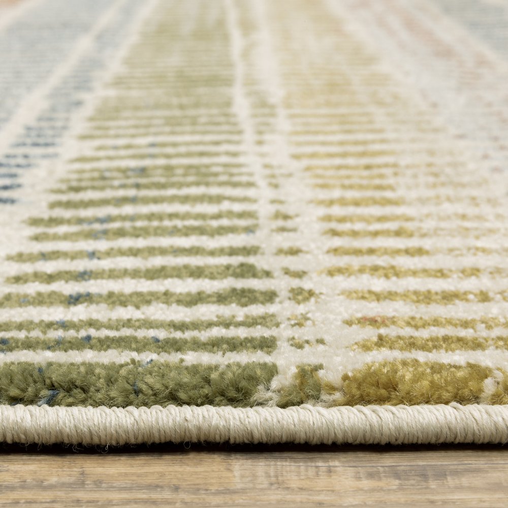 3' X 5' Ivory Blue Green Red And Gold Geometric Power Loom Stain Resistant Area Rug