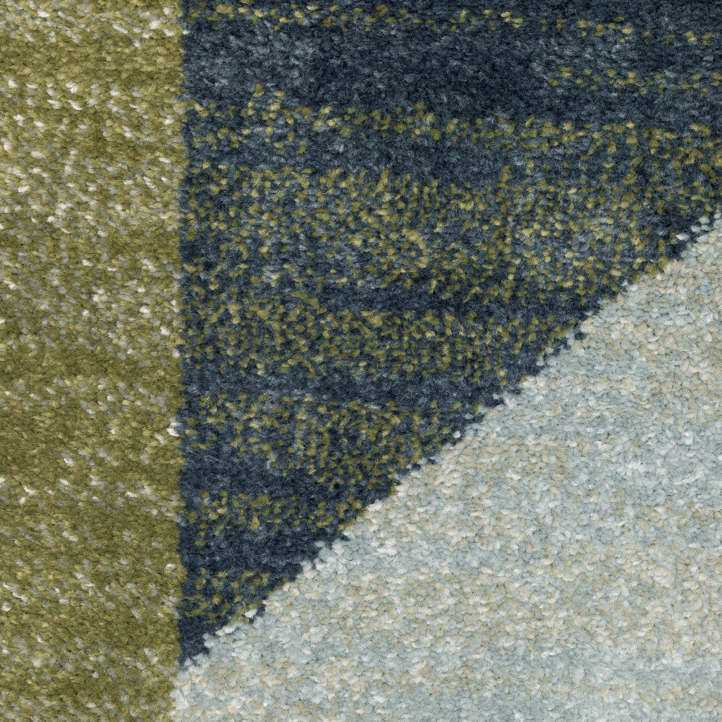 5' X 7' Grey Teal Blue Rust Green And Ivory Geometric Power Loom Stain Resistant Area Rug