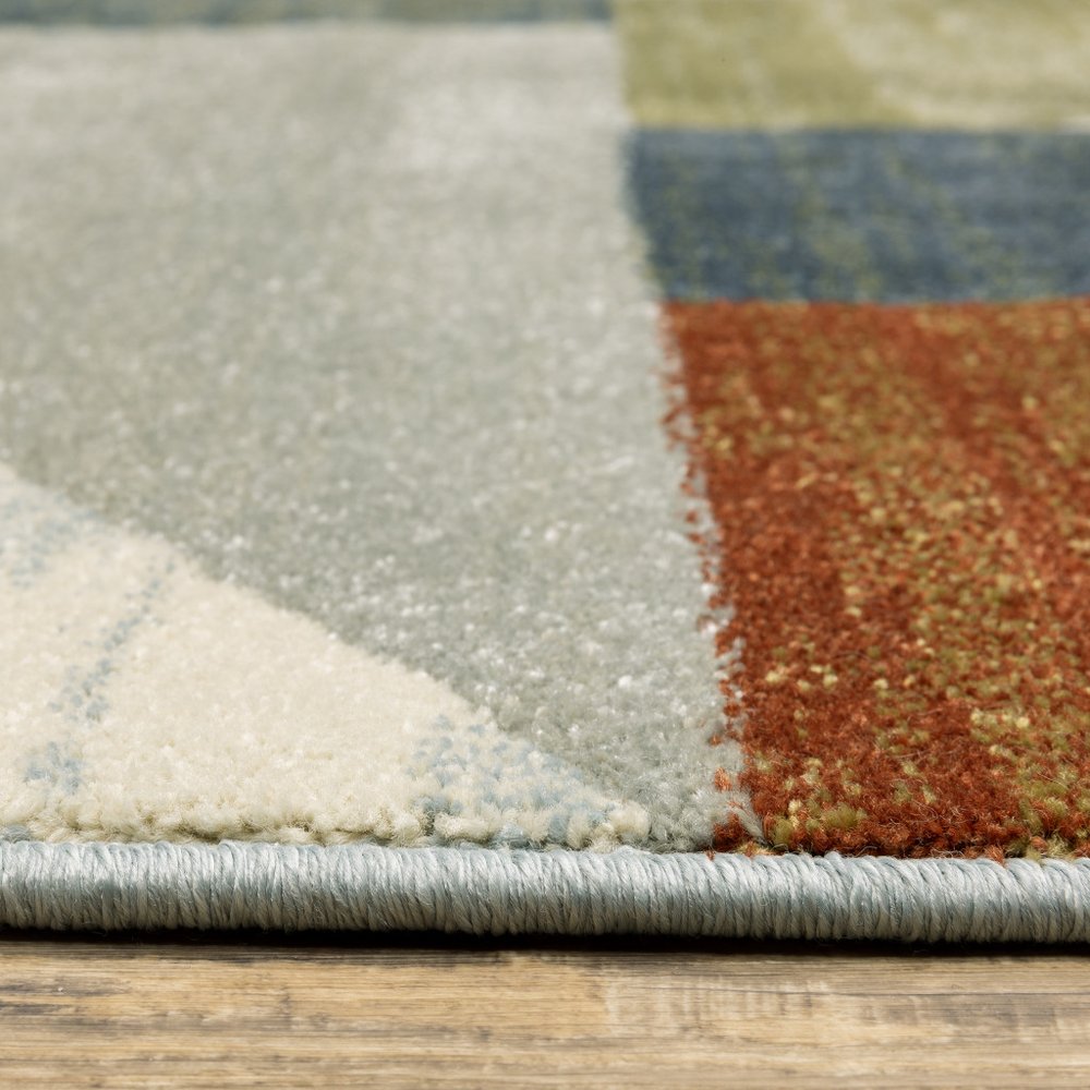 7' X 9' Gray And Ivory Geometric Area Rug