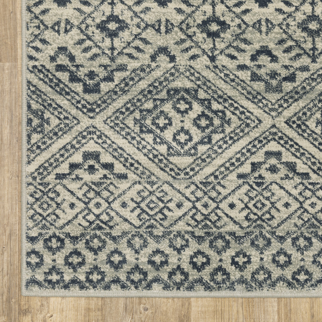 5' X 7' Blue And Beige Geometric Power Loom Stain Resistant Area Rug