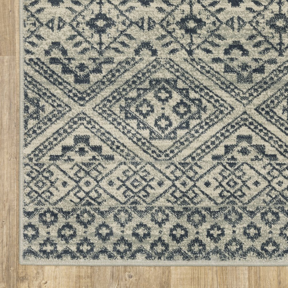 7' X 9' Blue And Beige Geometric Area Rug