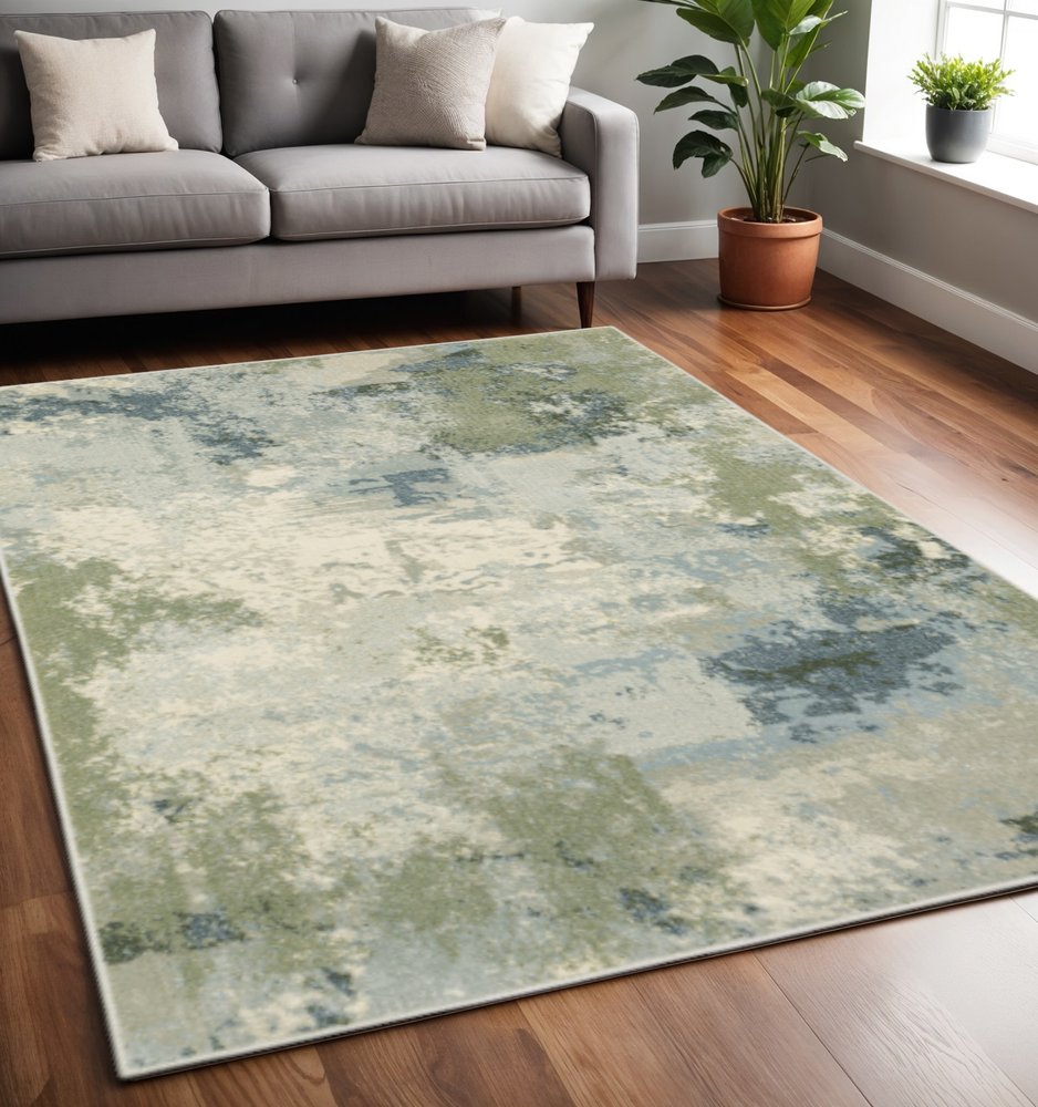 5' X 7' Blue Green Grey And Ivory Abstract Power Loom Stain Resistant Area Rug
