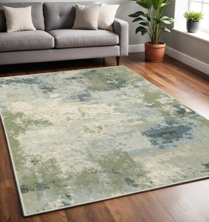 5' X 7' Blue Green Grey And Ivory Abstract Power Loom Stain Resistant Area Rug