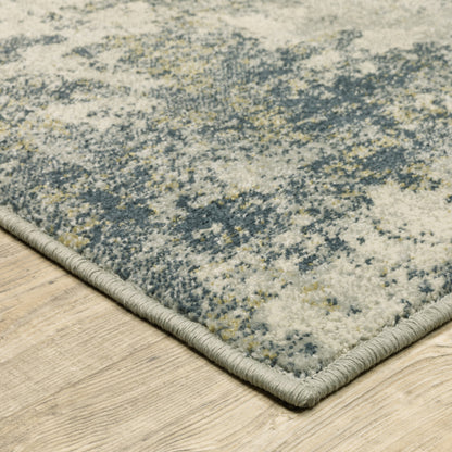 5' X 7' Beige Teal Grey And Gold Abstract Power Loom Stain Resistant Area Rug