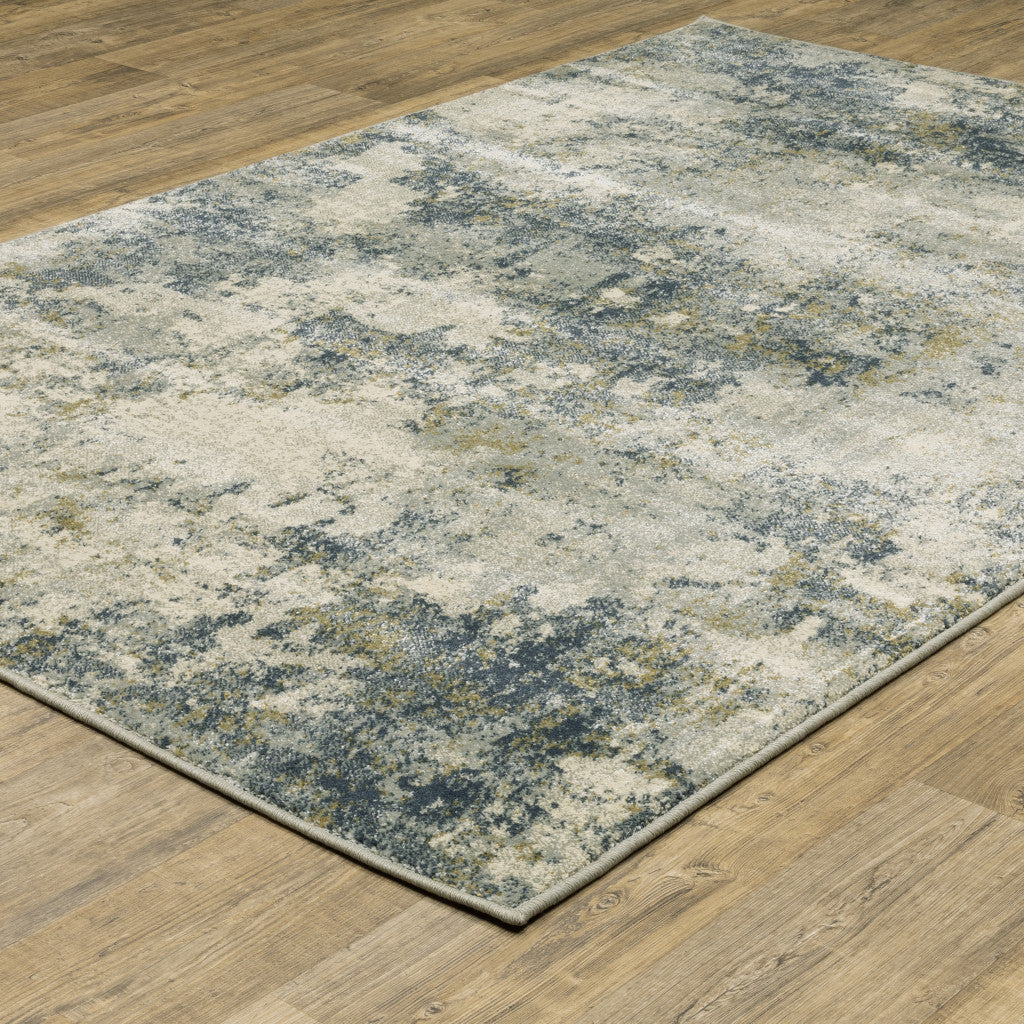 5' X 7' Beige Teal Grey And Gold Abstract Power Loom Stain Resistant Area Rug