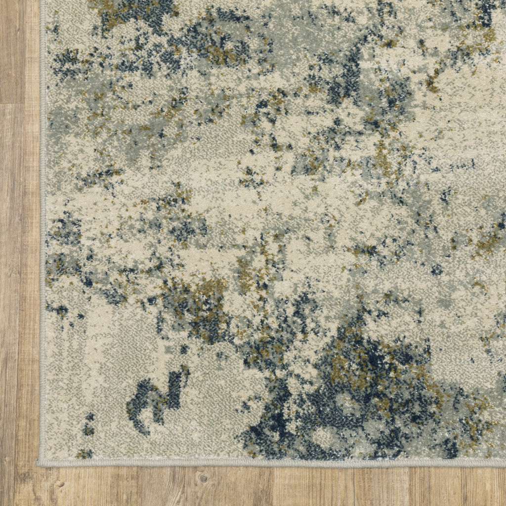 5' X 7' Beige Teal Grey And Gold Abstract Power Loom Stain Resistant Area Rug