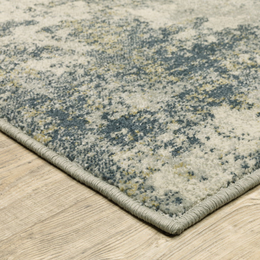 6' X 9' Beige Teal Grey And Gold Abstract Power Loom Stain Resistant Area Rug