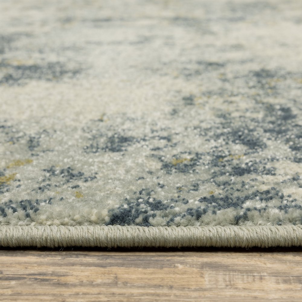 7' X 9' Beige And Ivory Abstract Area Rug