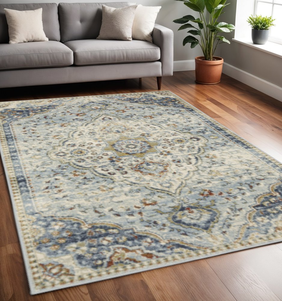 5' X 7' Blue Beige Rust Gold And Teal Oriental Power Loom Stain Resistant Area Rug