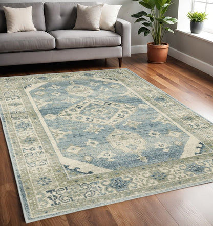 5' X 7' Blue And Beige Oriental Distressed Area Rug