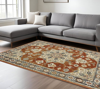 10' X 13' Rust Beige Teal Blue And Gold Oriental Power Loom Stain Resistant Area Rug